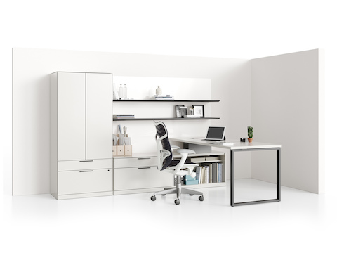 A Canvas Private Office with a white peninsula surface, white storage components, two aluminum floating shelves, and a black Mirra 2 office chair.