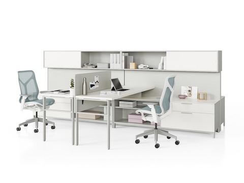 Two grey Canvas Wall workstations with white storage, surfaces, grey screens, and light blue Cosm Chairs.