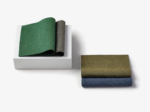 Two stacks of folded samples representing the Fractal fabric family.
