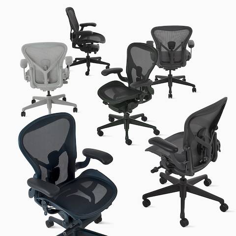 Six Aeron chairs in a group, in dark gray, gray, light gray, black, dark green, and dark blue.