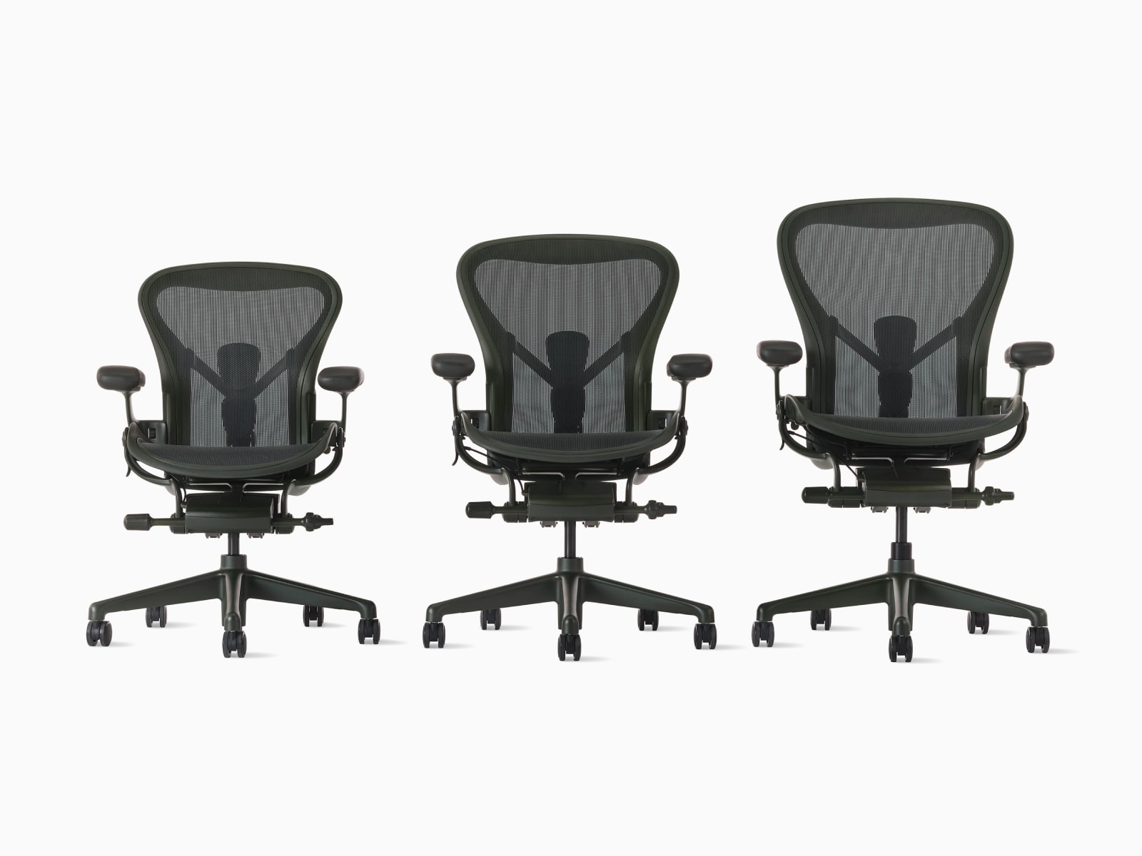Three Aeron chairs in dark green in ascending size order A, B, and C.