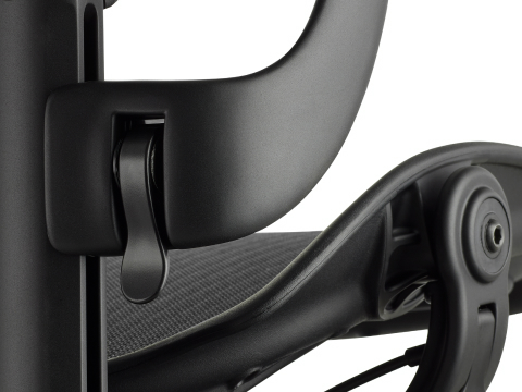 Detailed view of the Aeron arm height-adjustment feature in a black matte finish.