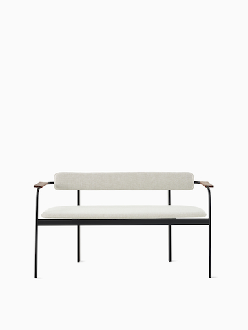 A Betwixt Bench with grey fabric seat and backrest, with walnut arms and a black frame.