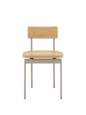 A Betwixt Chair with an oak seat and backrest with a grey frame. 