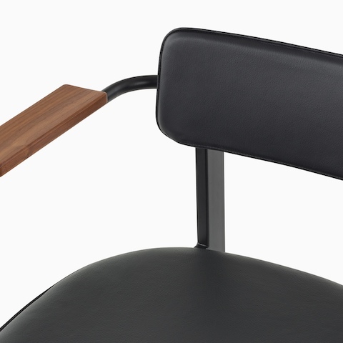 A close up of the leather seat and backrest of a Betwixt Chair.