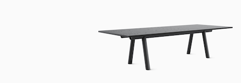 HAY Boa Table with black trestle base and ebonized oak rectangle top.