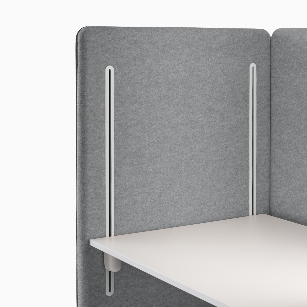 Detail of grey interior panel with desk glides and white worksurface on Bound Sit-Stand Booth.
