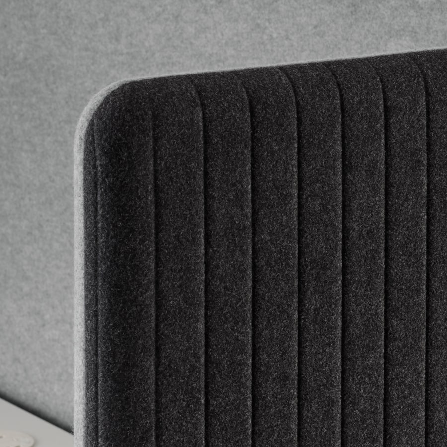 Detail of exterior panel option for Bound Sit-Stand Booth showing rounded soft fabric corner.