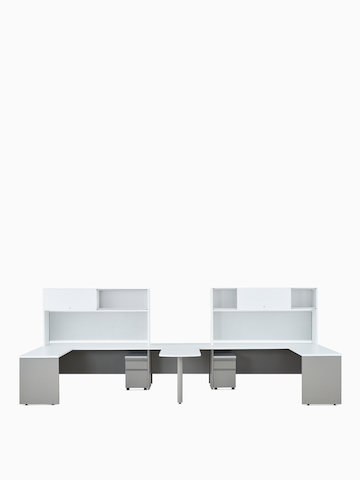 Two white and gray Canvas Metal Desks with upper storage and a peninsula surface.