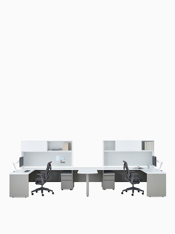Two white and gray Canvas Metal Desks with upper storage, Concerto Monitor Arms, and dark gray Cosm Chairs.