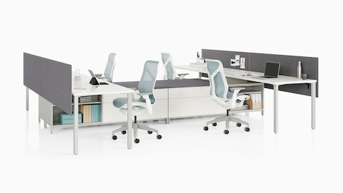 A Canvas Storage workstation with white surfaces, grey screens, and light blue Cosm office chairs.