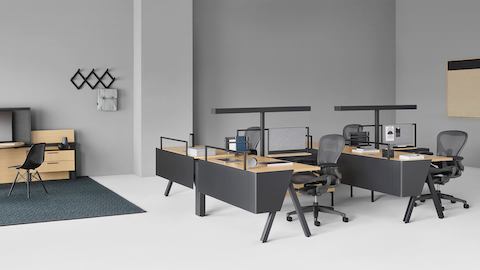 Canvas Vista workstations with black Aeron office chairs and a Canvas Vista collaborative space in the background.