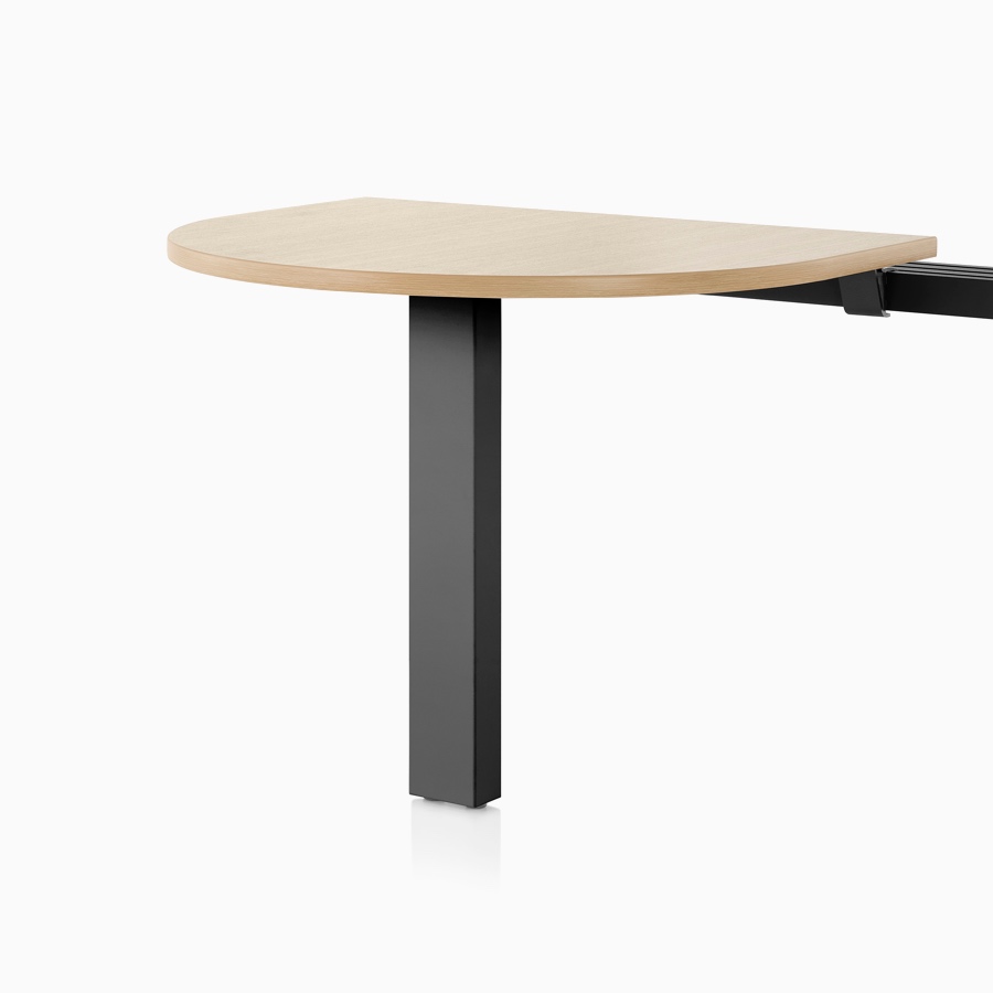 A light wood Canvas Vista peninsula surface mounted on a black post leg and chase.