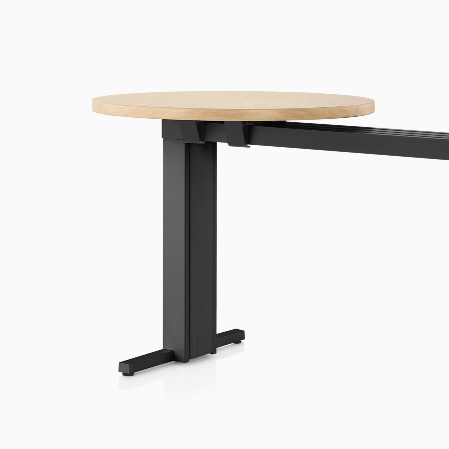 A light wood Canvas Vista café surface mounted on a black t-shaped leg and chase.