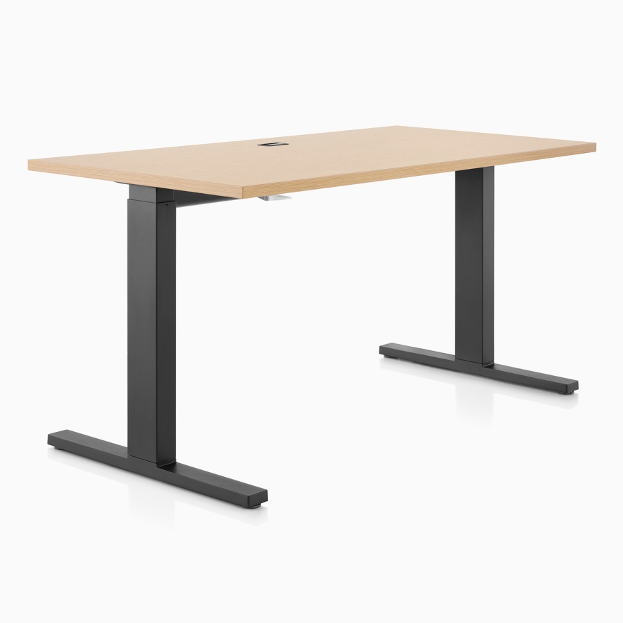 A light wood and black Motia height-adjustable table.