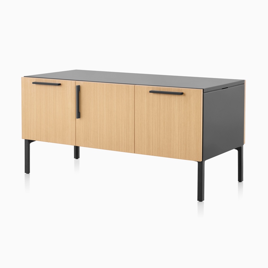 A light wood and black Tu Wood shared credenza with file, medicine cabinet, and tip-out bin.