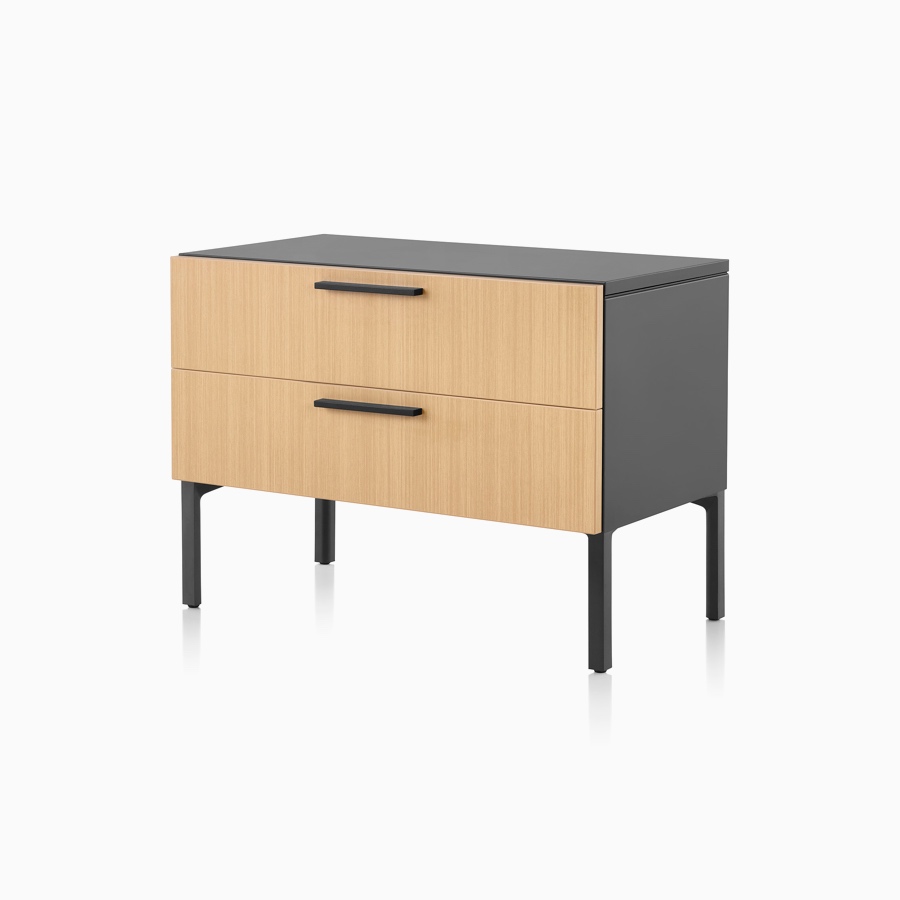 A light wood and black Tu Wood individual credenza with 2 box drawers.
