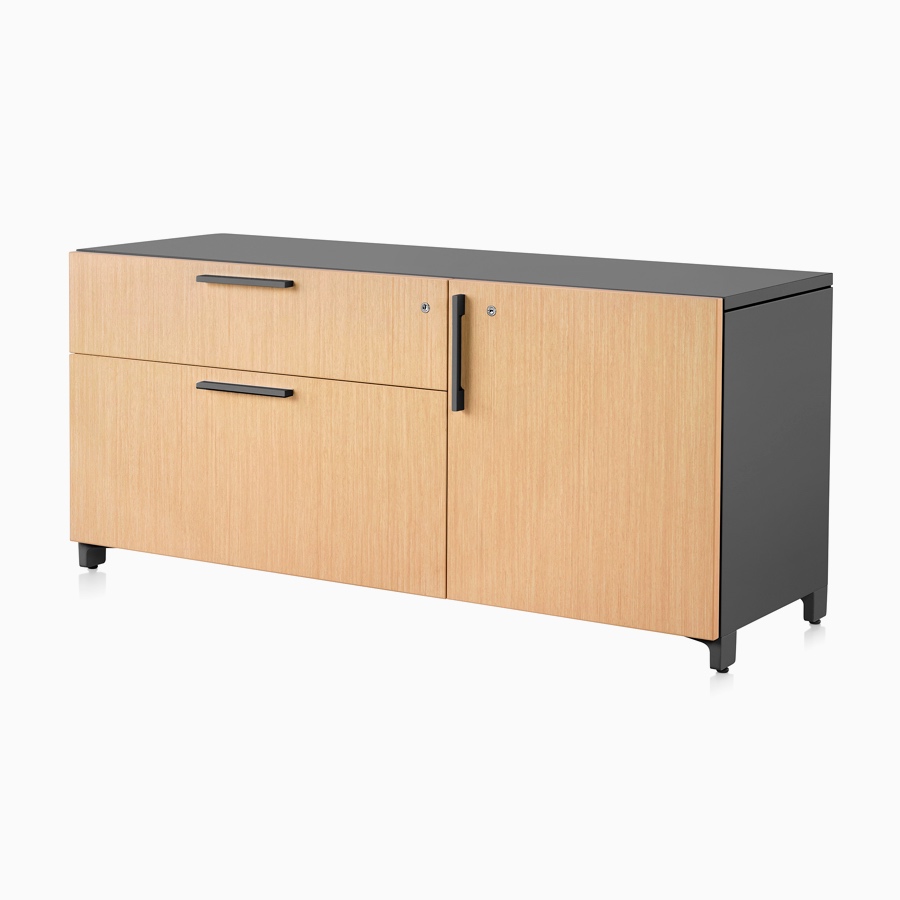 A light wood and black Tu Wood individual credenza with 2 box drawers and doors.