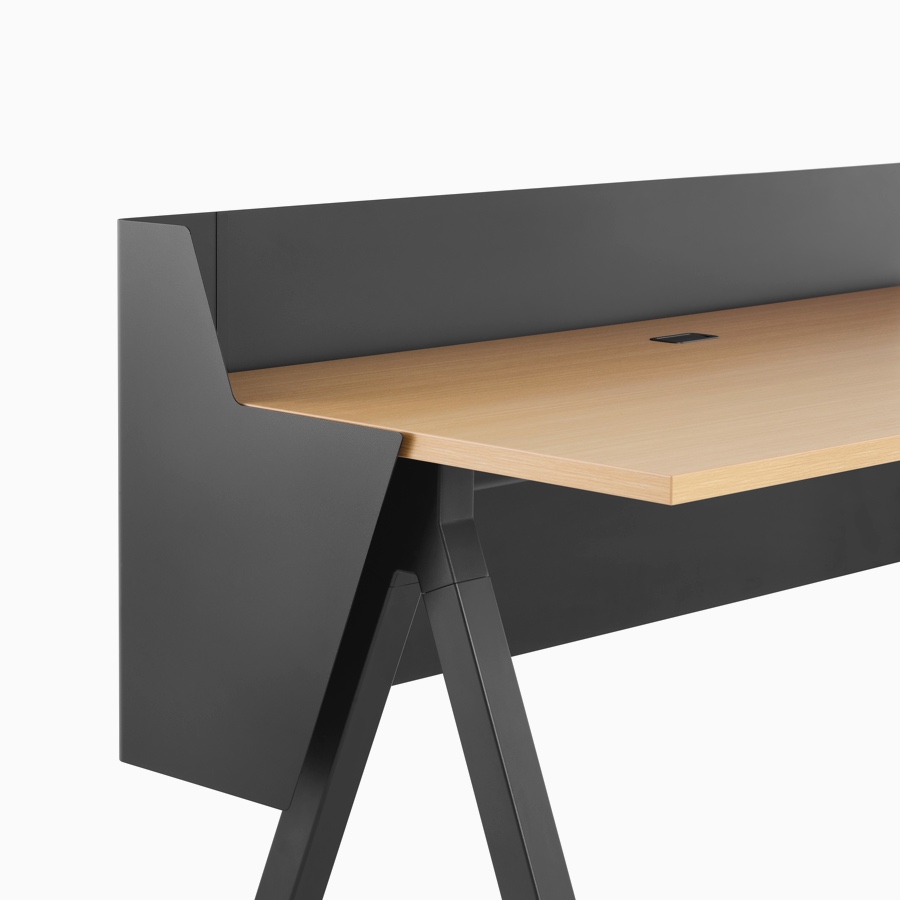 A black wrapped modesty and privacy screen with light wood and black Canvas Vista fixed-height table.