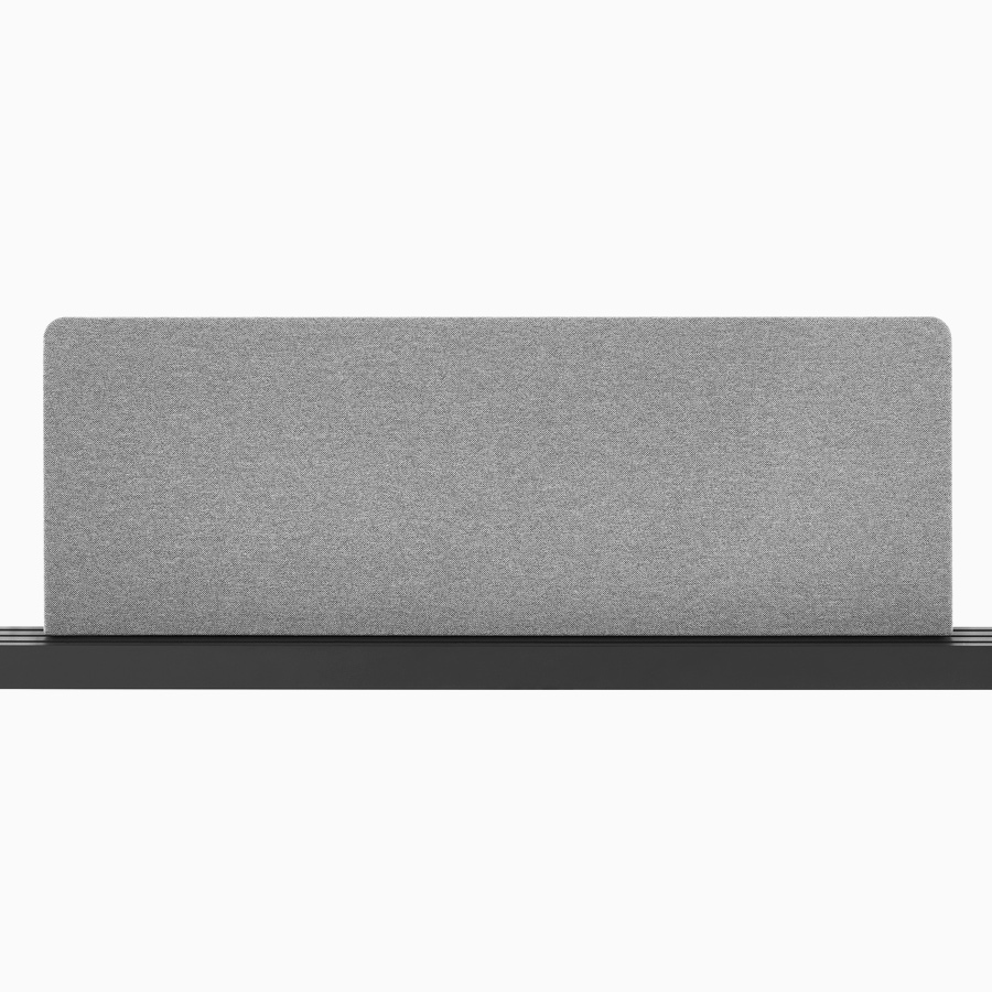 A grey fabric screen mounted on a black Canvas Vista power and data chase.