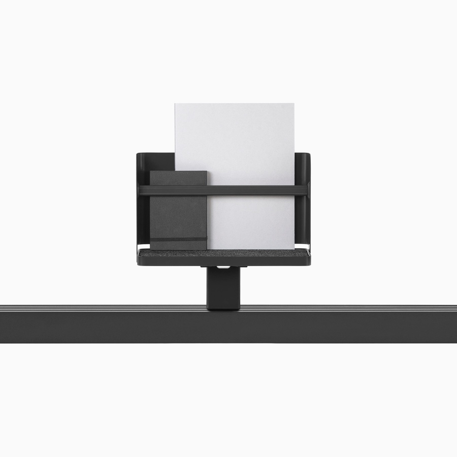 A Ubi attached shelf and storage mounted on a black Canvas Vista chase.