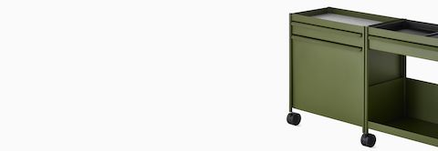 Green OE1 Storage Trolley with drawers, tip-out bin and shelf, viewed from an angle.