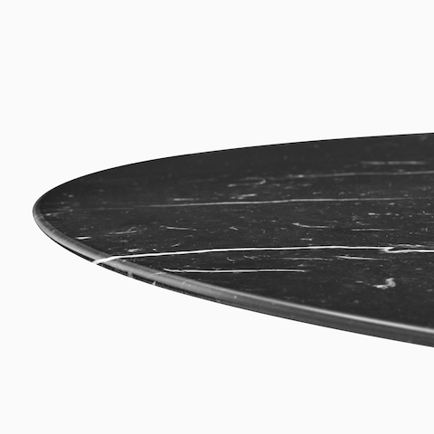 A close up view of a black marble Civic Table top.