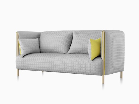 View from an angle of a light gray ColourForm sofa. 