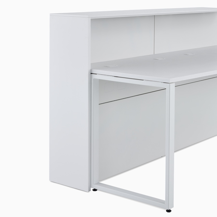 A close-up view of the 42 inch high structure option for prefab Commend Nurses Station providing a standing height boundary work surface with a loop leg.