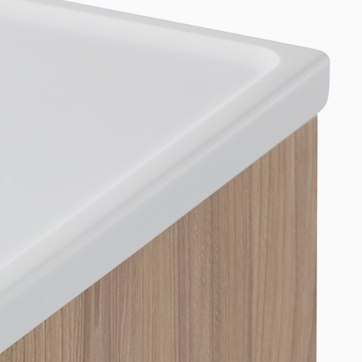 A close-up view of the white solid surface top on a Compass cart and featuring the grooved sides.