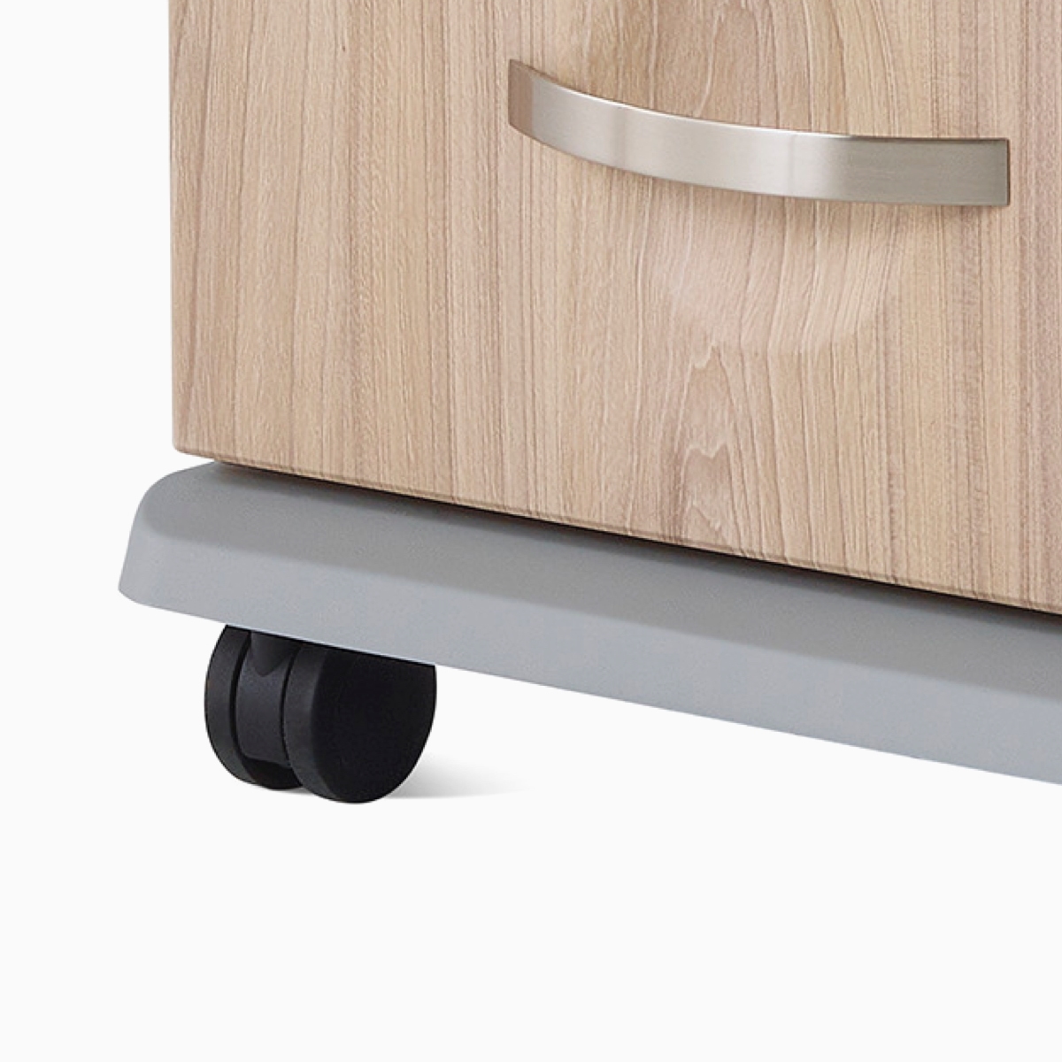 A close-up view of the protective bumper on the base of a Compass casework supply cart.