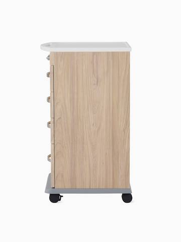 A Compass casework 4-drawer supply cart in a warm elm finish.