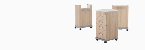 Compass casework carts, including a supply cart, a trash cart, and a linen cart in a warm elm finish.
