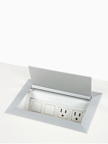 A Connect Power and Data port mounted into a work surface.