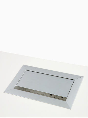 A Connect Power and Data port mounted into a work surface. Select to go to the Connect Power and Data product page.
