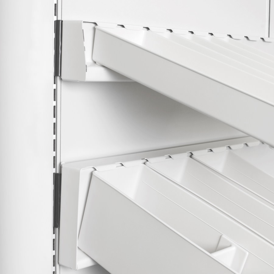 Close-up of Co/Struc panel with rail that has subcontainers attached for organization.