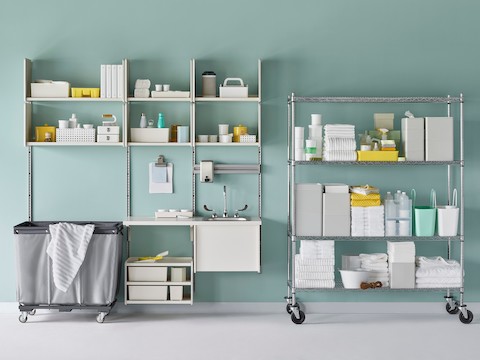 Medical soiled utility in soft white Co/Struc System including a sink and stainless steel wire shelving unit.