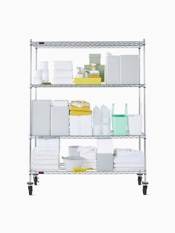 Front view of a wire shelving storage unit on casters with four shelves.