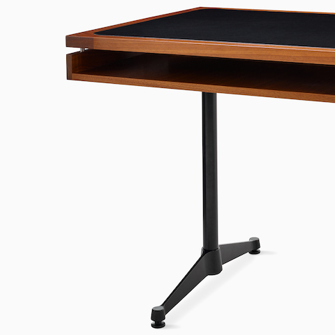 Detail of the secondary storage shelf of the Eames 2500 Series Executive Desk in walnut