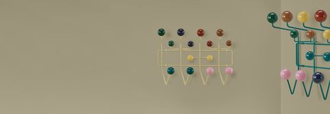 Eames Hang-It-All on sage background.