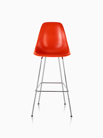 Red Eames Molded Fiberglass Stool. Select to go to the Eames Molded Fiberglass Stool product page.