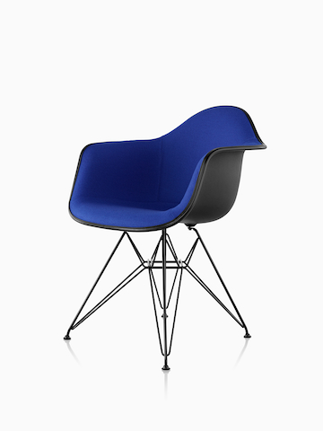Eames Molded Plastic Armchair in blue textile with wire base. Select to go to the Eames Molded Plastic Chairs product page.