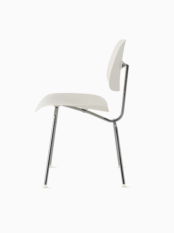 A side view of an Eames Molded Plastic Dining Chair EC-127 with white shell