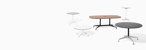 Five Eames Tables of various heights, top shapes, finishes, and base styles.