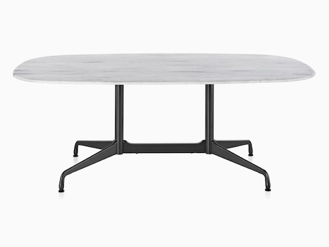 An oval Eames outdoor table with a white marble top and black base.
