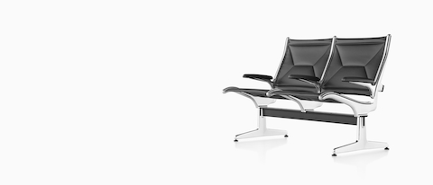 Angled view of black leather Eames Tandem Sling Seating with two seating positions. 