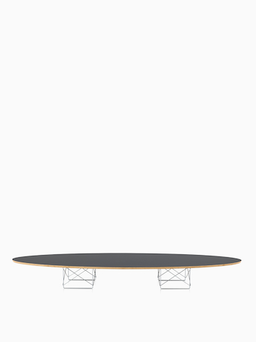 An Eames Wire Base Elliptical Table with a gray top.