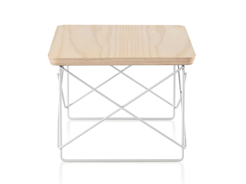 An Eames Wire Base Low Table with a white ash veneer top. 