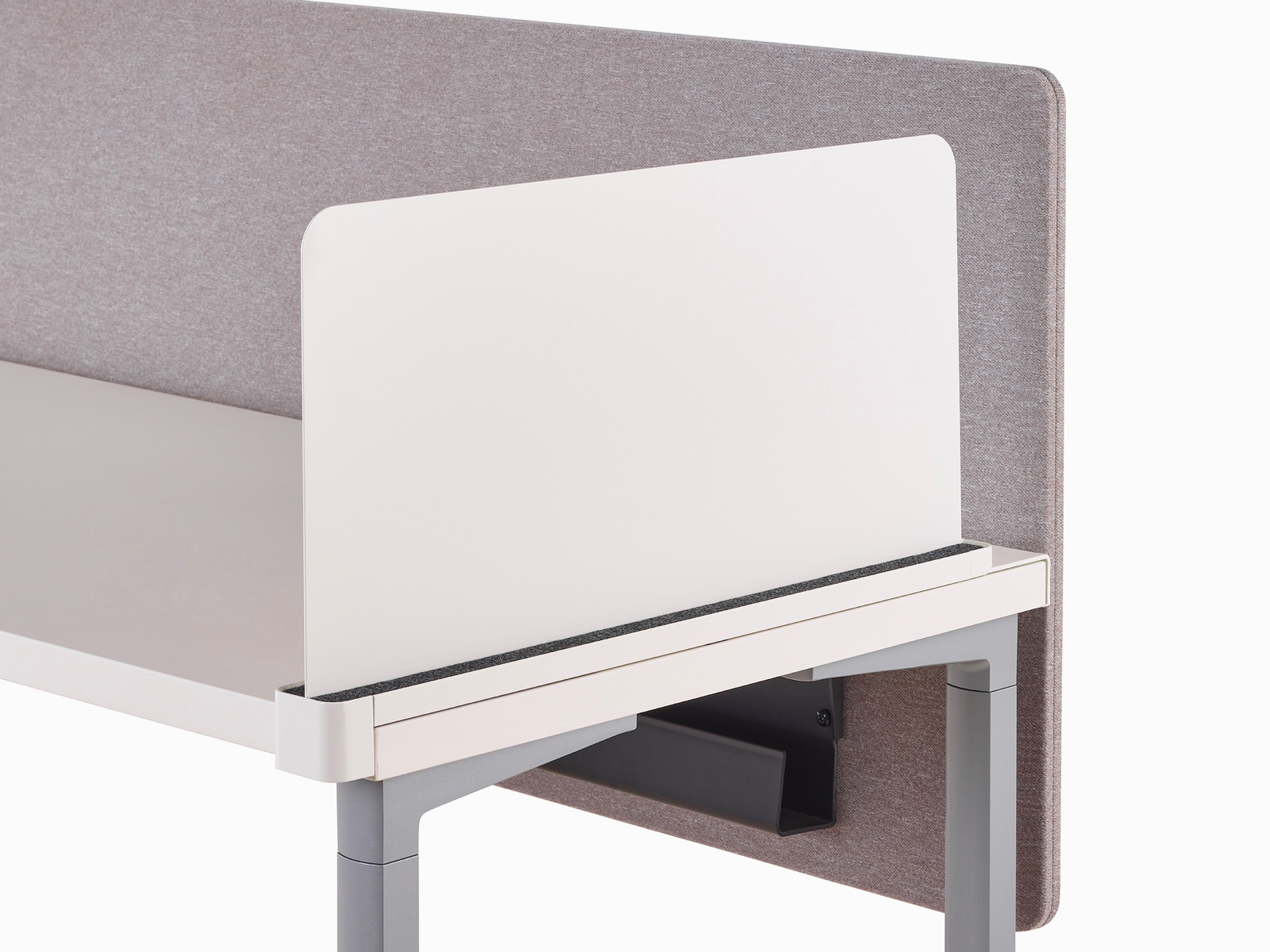 Close-up of a white Ubi slim metal delineation side screen with a cable trough found attached to a privacy screen beneath an Everywhere Table.