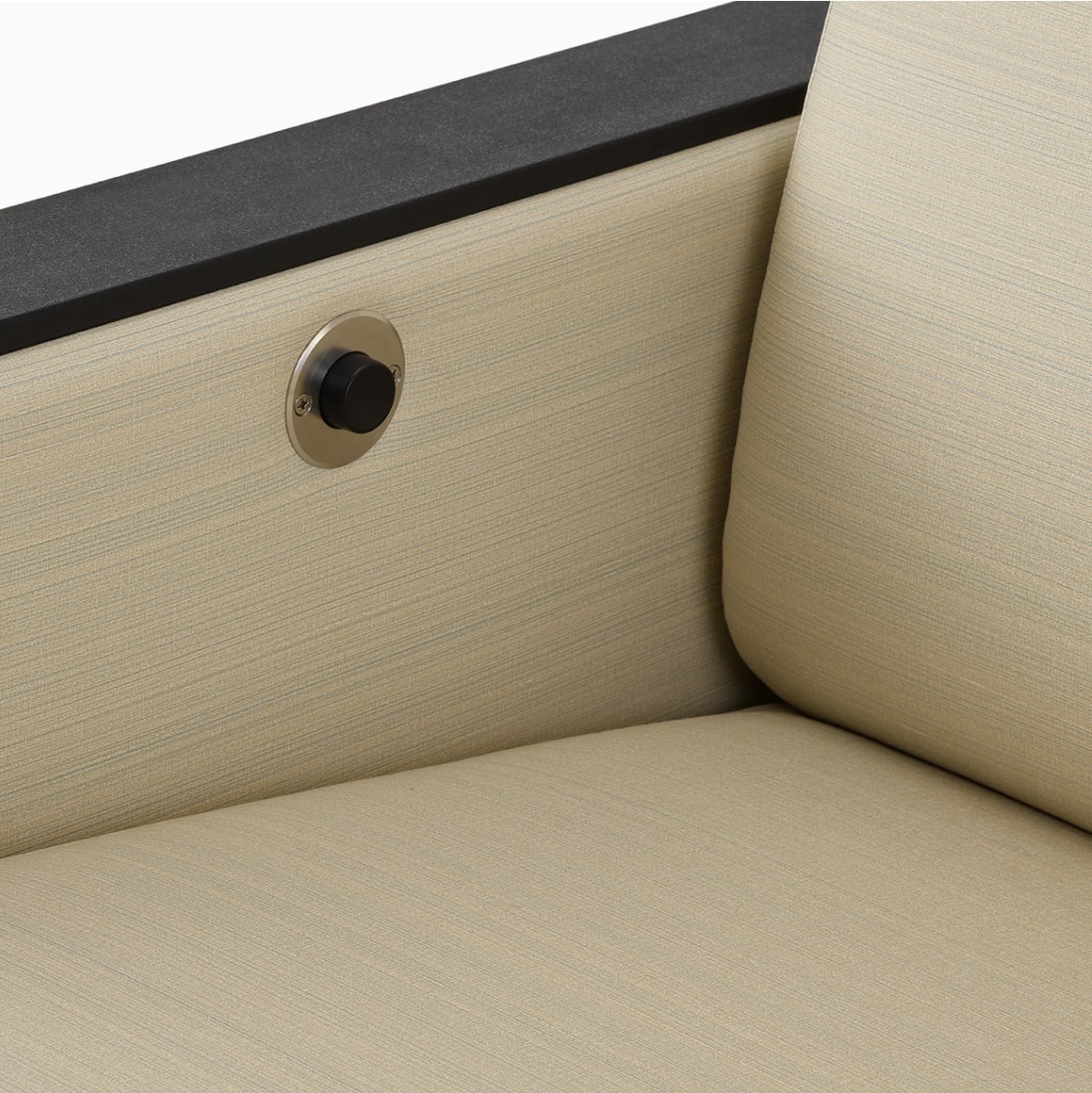 Gemma Recliner with a detailed view of armrest and cushion spacing to enable easy clean-out design.